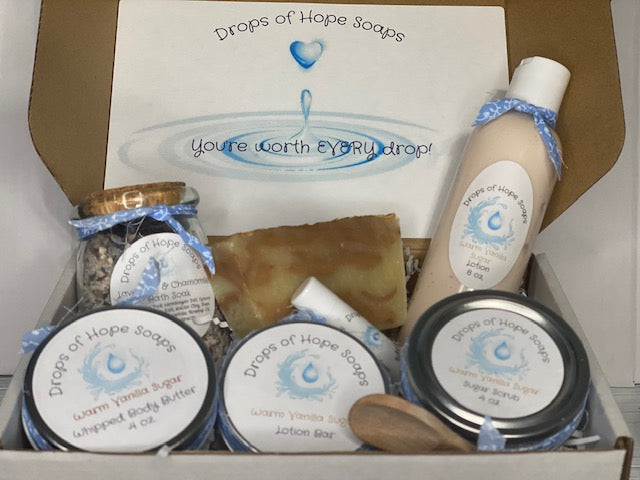 All-Natural Deluxe Skin Care Set. Warm Vanilla Sugar fragrance. Set includes bath salts, lip balm, lotion, lotion bar, body butter, and sugar scrub. All-Natural organic ingredients.