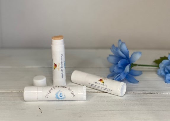 Give your lips the nourishment they need with our ultra-hydrating Moisturizing Lip Balm. Formulated with natural oils and waxes, this lip balm locks in moisture to keep lips soft, supple, and silky. Our lightweight formula is non-greasy and won't leave a waxy or sticky residue. Plus, it has a pleasant, natural scent that won't overwhelm your senses.