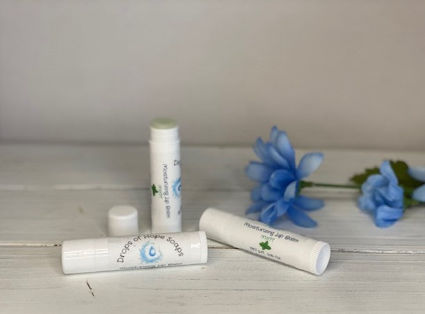 Give your lips the nourishment they need with our ultra-hydrating Moisturizing Lip Balm. Formulated with natural oils and waxes, this lip balm locks in moisture to keep lips soft, supple, and silky. Our lightweight formula is non-greasy and won't leave a waxy or sticky residue. Plus, it has a pleasant, natural scent that won't overwhelm your senses.