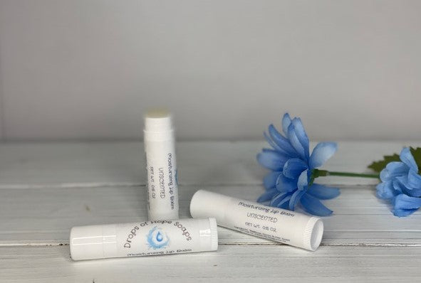 Give your lips the nourishment they need with our ultra-hydrating Moisturizing Lip Balm. Formulated with natural oils and waxes, this lip balm locks in moisture to keep lips soft, supple, and silky. Our lightweight formula is non-greasy and won't leave a waxy or sticky residue. Plus, it has a pleasant, natural scent that won't overwhelm your senses.